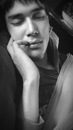 Close-up portrait of young man smiling at home