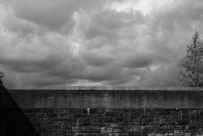 View of wall against cloudy sky