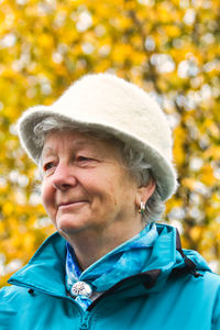 Portrait of a smiling senior woman with a hat