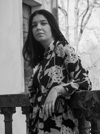 Portrait of young woman standing outdoors