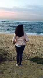 Rear view of woman on beach