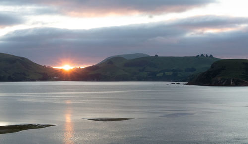 Scenic view of mountains against sky during sunset