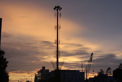 Low angle view of electricity pylon against sky