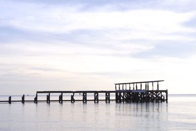 Pier over sea against sky