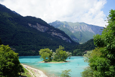 Scenic view of mountains and trees against sky