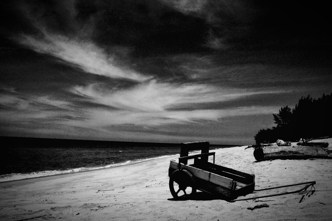 sea, water, tranquility, beach, tranquil scene, horizon over water, scenics, sky, shore, beauty in nature, sand, nature, bench, empty, idyllic, absence, cloud - sky, pier, calm, non-urban scene