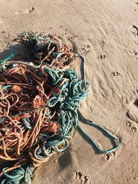 High angle view of fishing net on beach