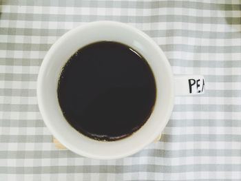 Directly above shot of coffee cup on table