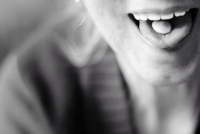 Close-up of  woman eating candy