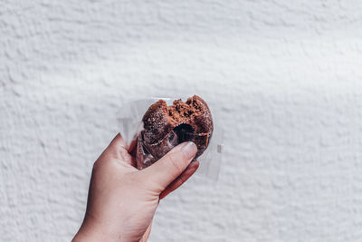 Close-up of hand holding ice cream