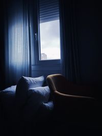 View of bed through window at home