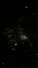 High angle view of illuminated buildings in city at night