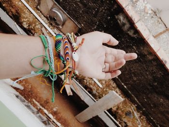 Cropped hand with fashionable bracelets