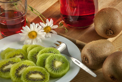 High angle view of kiwi in plate on table