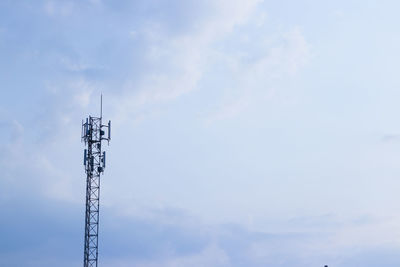 Low angle view of communications tower against sky