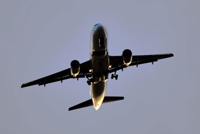 Low angle view of airplane flying in sky