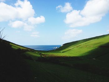 Scenic view of sea against cloudy sky