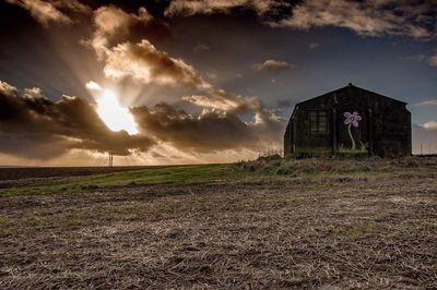 Field against cloudy sky