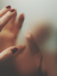 Close-up of woman holding hands