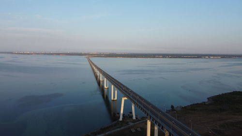 Bridge over sea against sky