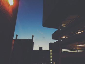 Low angle view of illuminated building against sky