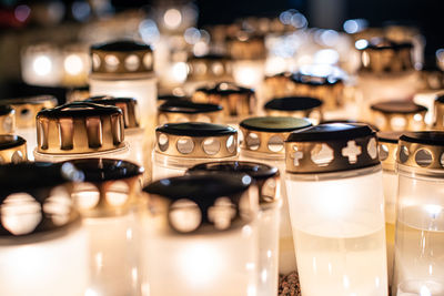 Grave candles on a cemetery on all saints eve
