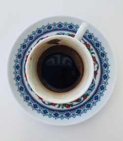 High angle view of coffee cup on table