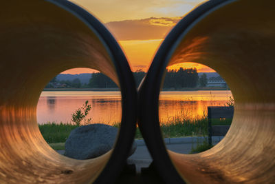 Scenic view of sunset seen through arch