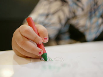 Close-up of child drawing paper