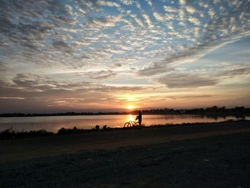 Scenic view of sea against sky at sunset