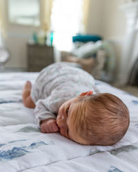 Cute baby sleeping in bed