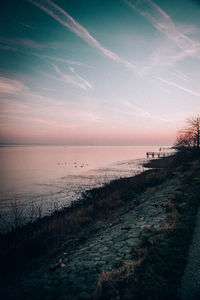 Scenic view of sea against sky at sunset