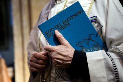 Close-up of man holding text