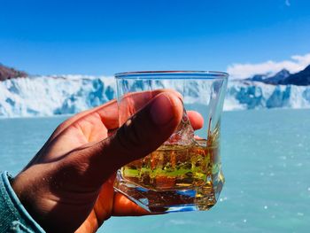 A whiskey on the rocks in front of the o-higgins glaciar with original glacier ice