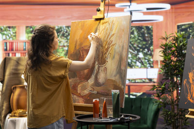 Rear view of woman looking at market