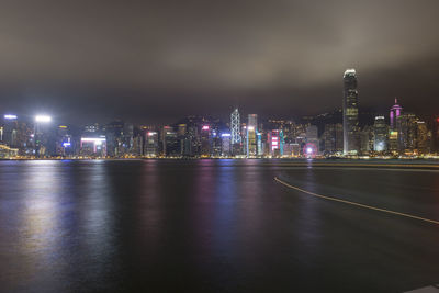 Illuminated city buildings at night