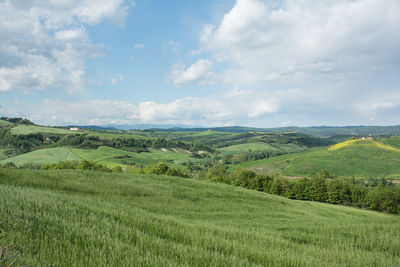 Scenic view of landscape against cloudy sky