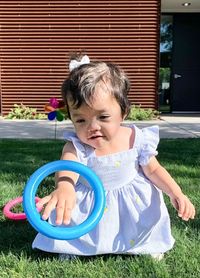 Little girl playing in yard