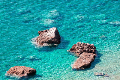 Turquoise water with natural rocks in the sea