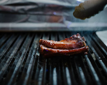 Close-up of meat on barbecue grill