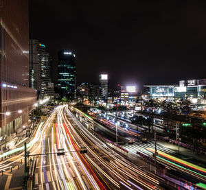 High angle view of light trails on road at night