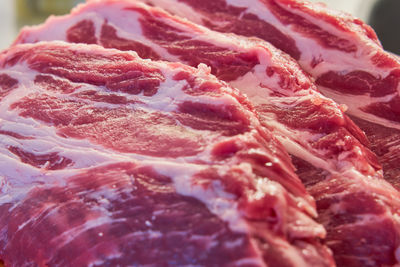 The structure of red pork steaks close-up.