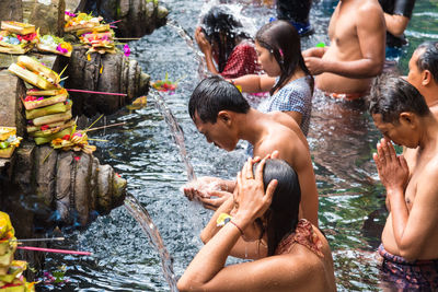 Group of people enjoying in water