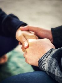 Close-up of man holding hands