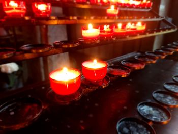 Close-up of illuminated tea light candles