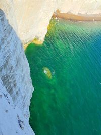 High angle view of rock formation in sea