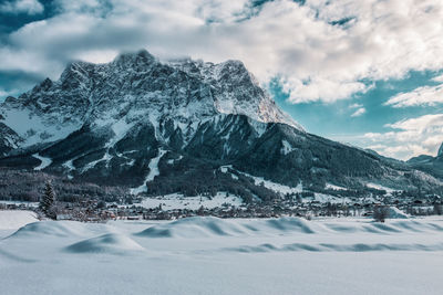 Scenic view of snowcapped mountains against sky