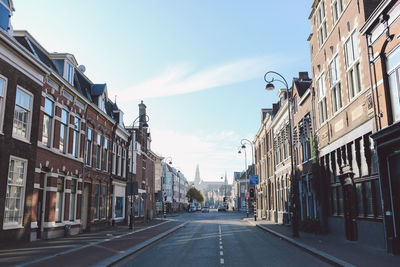 Street amidst residential buildings in city