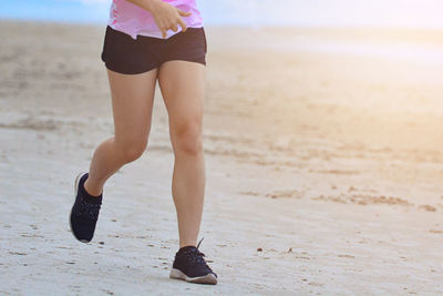 Low section of woman on beach