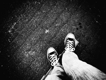 Low section of woman standing on ground